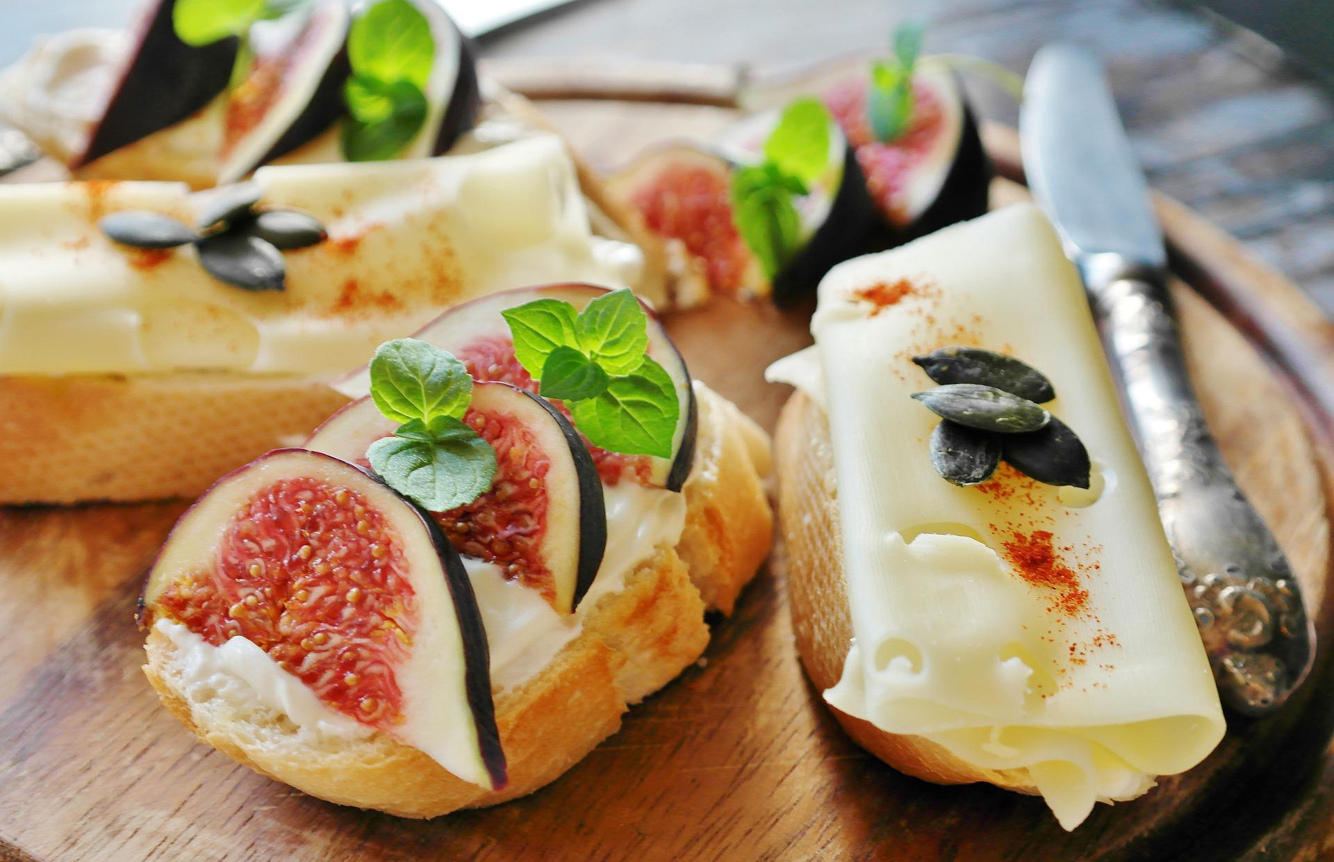 A cheese platter with figs.