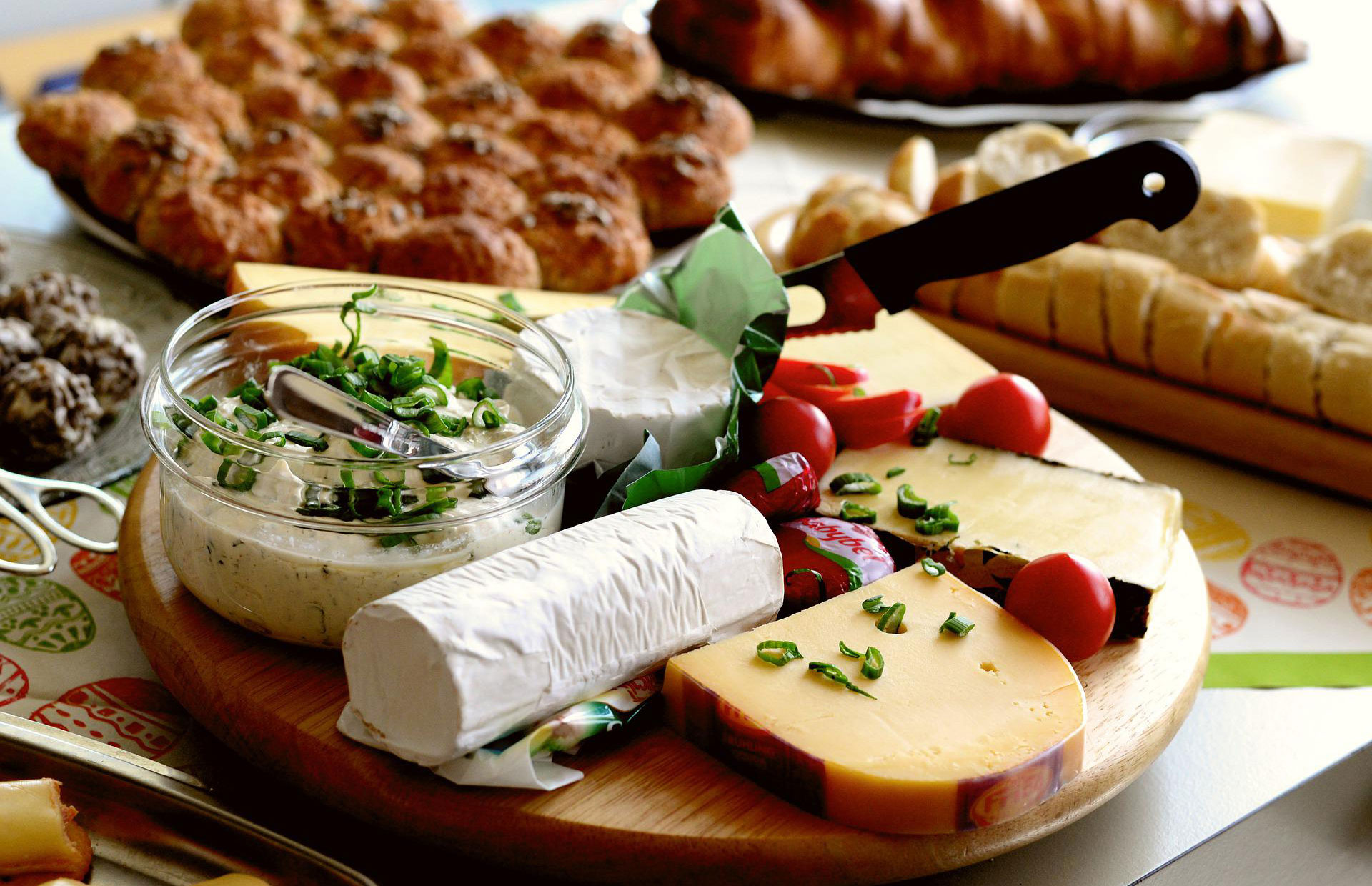 A cheese plate with other baked goods.